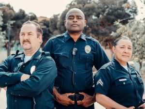 three police officers in blue uniform