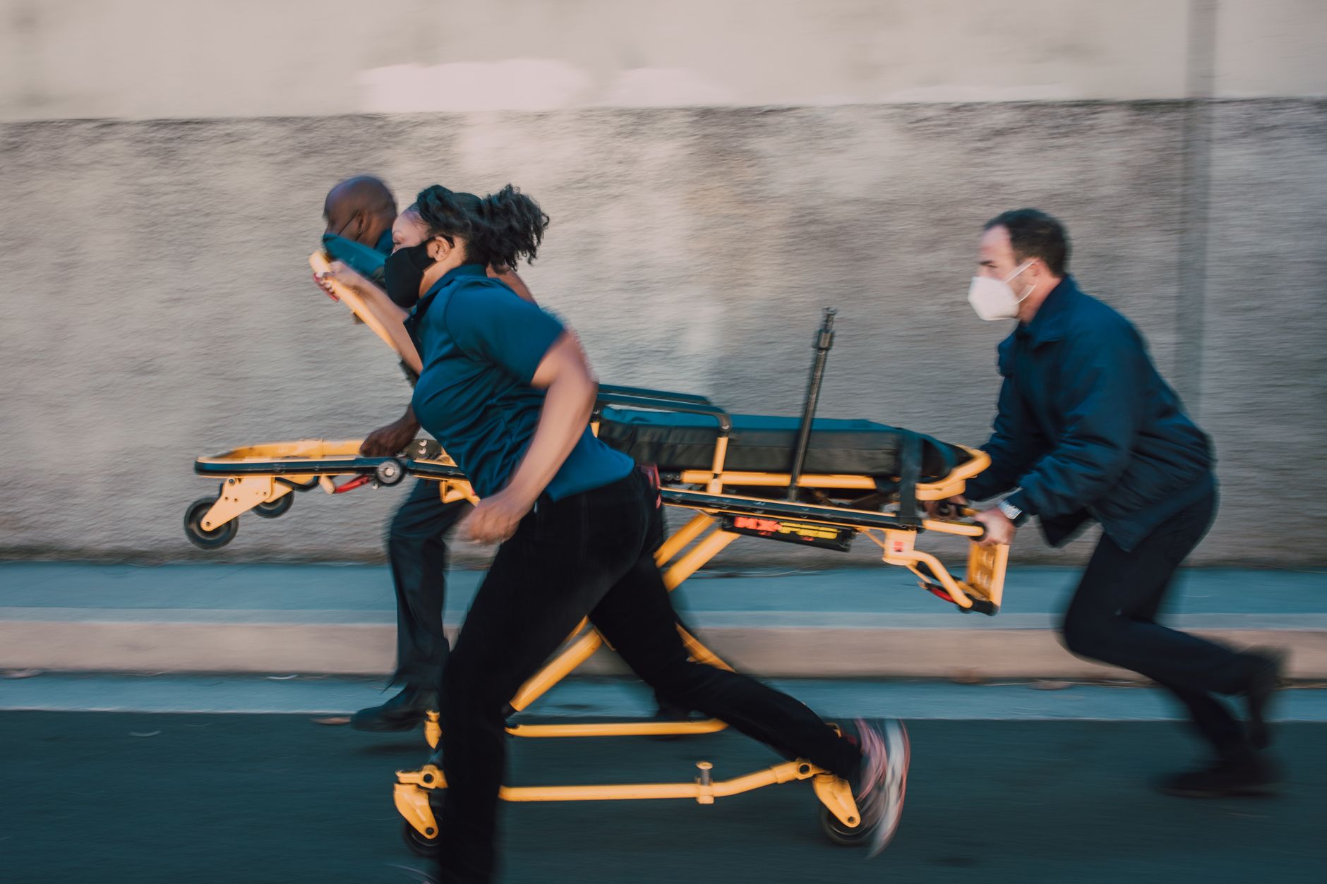 paramedics pushing a stretcher